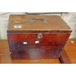 An old wooden lift-top box with brass handle and escutcheon