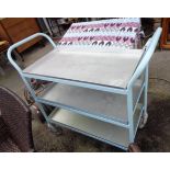 A vintage tubular industrial catering trolley with three set-in aluminium trays with later blue