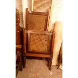 An early 20th Century wooden child's cot with rattan panels