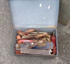 An old black japanned lift-top box containing a quantity of woodworking tools