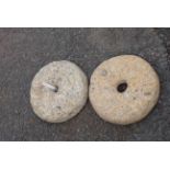 Two old small granite mill grinding wheels
