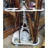 A Victorian cast iron stick stand with white painted finish