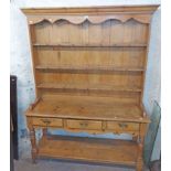 A 1.5m antique pine Welsh two part dresser with three shelf open plate rack over a potboard base