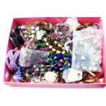 A tray containing a large quantity of assorted costume jewellery necklaces and bracelets, etc