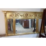 A 1.4m reproduction ornate gilt framed Georgian style triple bevelled plate overmantle mirror with