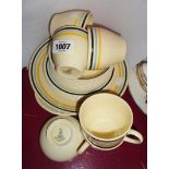 A 1930's Royal Doulton part tea service comprising five trios, sugar bowl, bread and butter plate