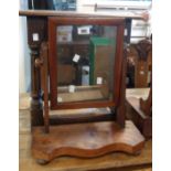 A Victorian mahogany platform dressing table mirror with oblong plate and serpentine base