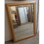 A modern gilt framed oblong wall mirror