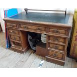 A 1.22m Victorian oak twin pedestal desk with green leather inset writing surface over central