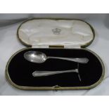 A cased Sheffield silver spoon and pusher in Mortimer Ricks, Victoria Street, Paignton retailers