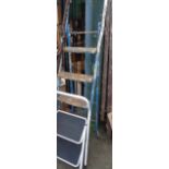 An old metal stepladder with blue painted finish - sold with a small two step similar