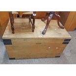 A 97cm old pine lift-top linen chest with painted metal strapping and flanking iron drop handles,