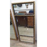 A 1.1m old gilt framed oblong wall mirror with triple plate and ebonised beaded decoration