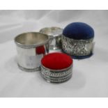 Two blank silver napkin rings - sold with silver mounted pin cushions including one formed from a