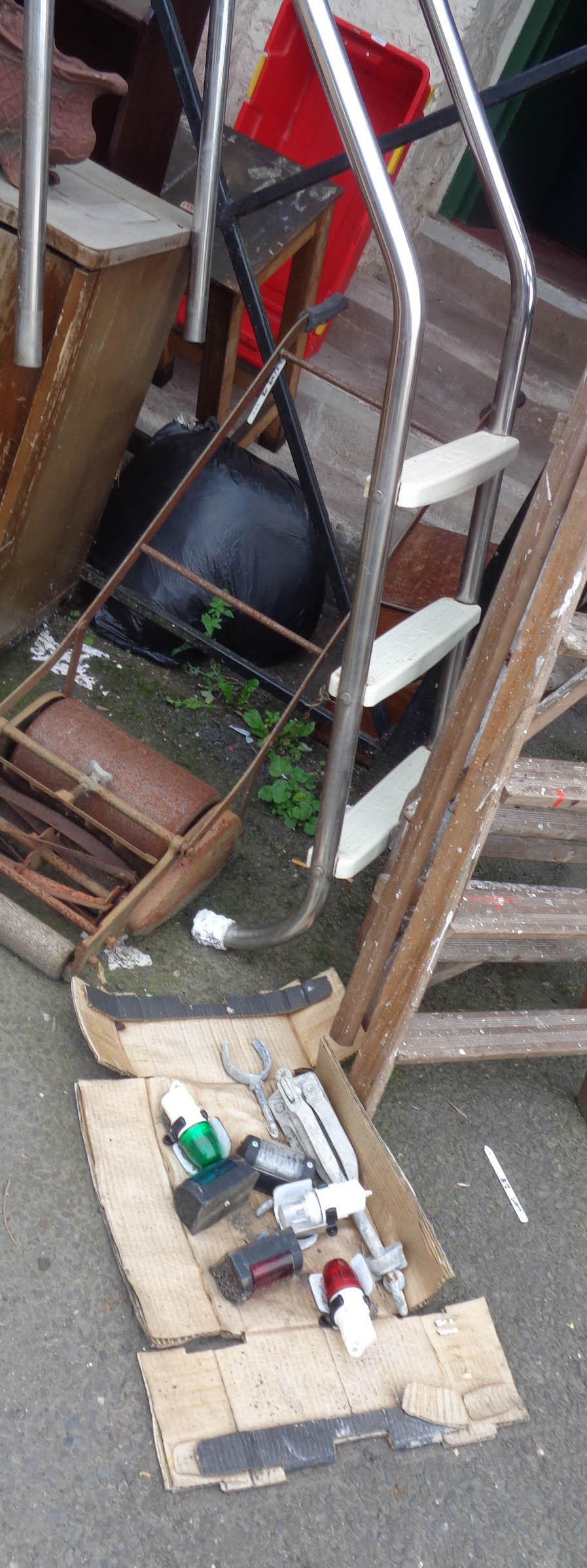 A swimming pool ladder - sold with a box containing nautical navigation lights, anchor, etc.