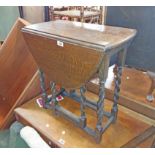 A 60cm 20th Century stained oak gateleg table, set on barley twist supports