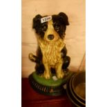 A modern painted cast iron doorstop in the form of a seated collie