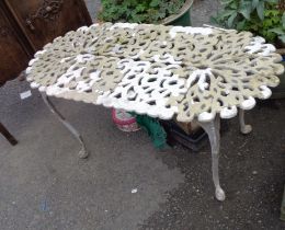 A small cast aluminium garden table with pierced top
