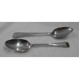 Two silver table spoons comprising London 1827 with intials to terminal and a blank London 1903