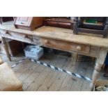 A 1.82m Victorian pine farmhouse table with solid three plank top over two frieze drawers, set on