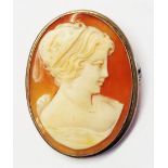 An 800 grade white metal framed oval cameo brooch