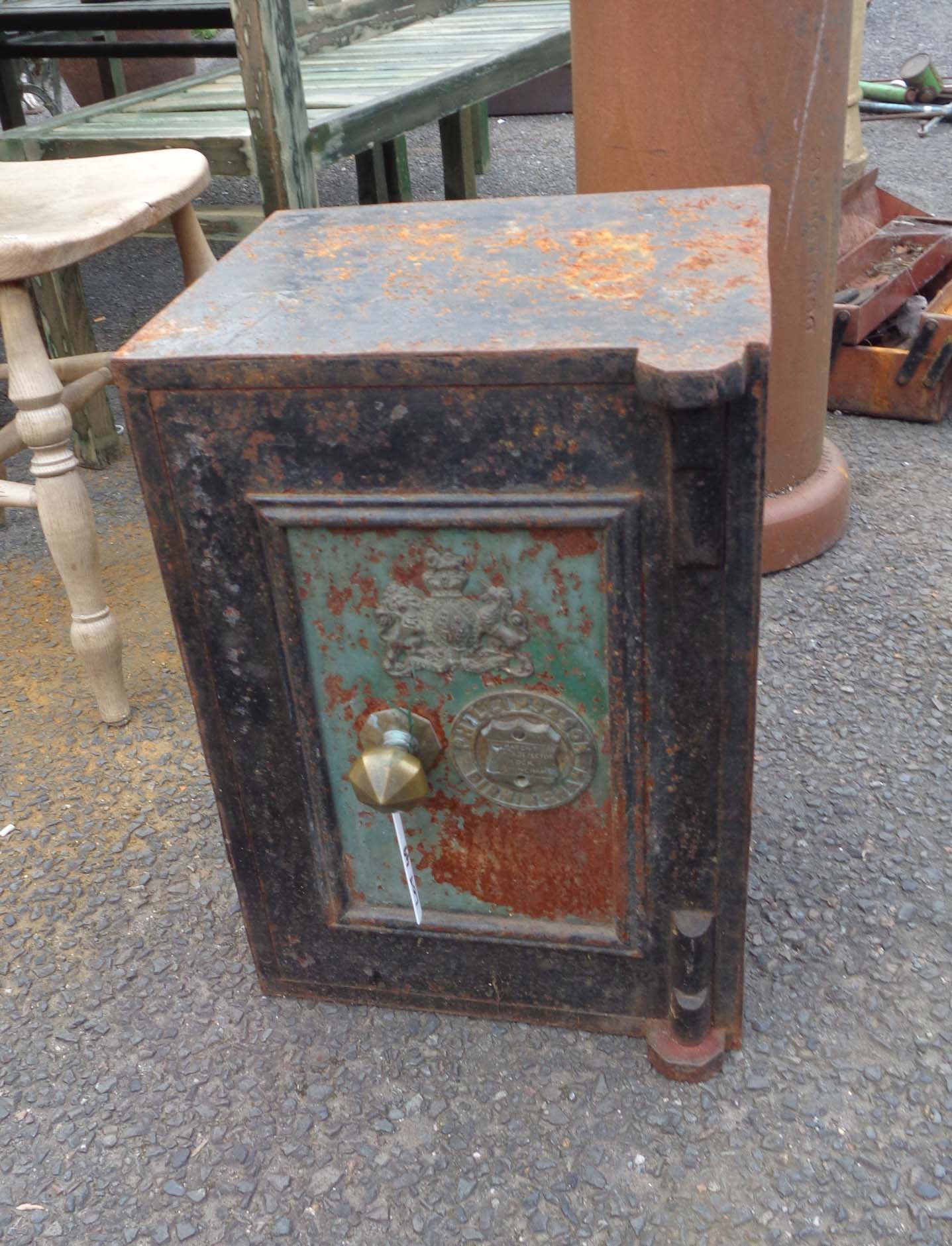 A small Victorian cast iron safe with brass fittings made by Phillips & Co. of Birmingham - with