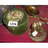 An old sewing box containing a vintage cast brass door knocker in the form of a dog's head with