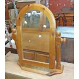 A modern pine framed platform dressing table mirror with shaped plate, set on serpentine base