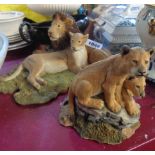 Two Sherratt & Simpson resin figurines depicting lions and lion cubs