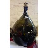 An early 19th Century large green bottle glass carboy with later lamp conversion