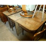 A 19th Century mahogany D-end dining table with centre section and two demi-lune ends, set on ring