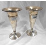 A pair of 20cm high silver trumpet vases with loaded circular bases - Birmingham 1937 - dents