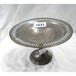 A 9.5cm high silver pedestal dish with pierced decoration to rim - Birmingham 1963