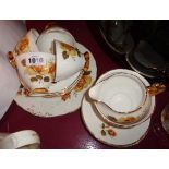 A Royal Imperial bone china part tea set comprising four trios, milk and sugar, bread and butter