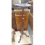 A Victorian style mahogany jardiniere stand, set on an acanthus turned pillar and tripod base with