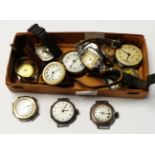 A box containing a small collection of vintage wristwatches including three import marked silver