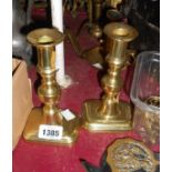 A pair of 19th Century cast brass candlesticks