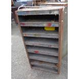 An old metal workshop pigeon-hole racking unit with grey painted finish