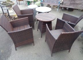 A rattan effect Chelsea Garden Co. outdoor furniture patio set comprising four chairs and two