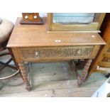 A 77cm antique quartersawn oak side table with carved decoration to single frieze drawer, set on