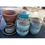 Nine assorted large glazed and terracotta garden plant pots, some with stands