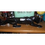 A large ceramic model of a stalking panther