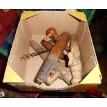 A box containing a quantity of vintage wooden barrel taps, etc.
