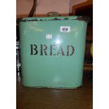 A vintage enamel bread bin with black lettering on a green ground