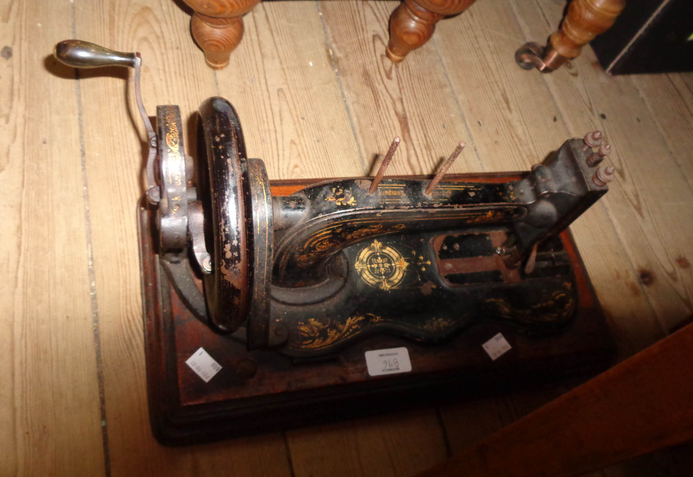 An old Singer sewing machine, in wooden case - sold with two similar uncased examples - Image 3 of 3