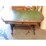 A 1.18m Victorian figured walnut centre table with later green leatherette inset top and shaped