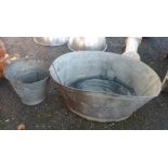 A galvanised bath - sold with a similar bucket