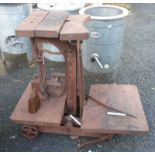 A set of antique cast iron potato scales with wooden fittings