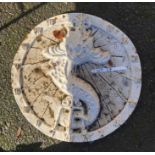 A modern painted cast iron sundial with grotesque fish design