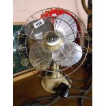 A vintage Limit desk fan with cast iron painted base and chrome plated fan and cage